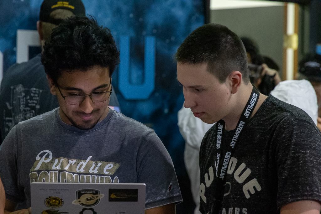 Team Members looking at a laptop